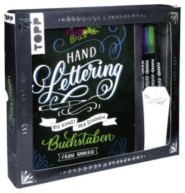 Handlettering-Set mit deutschem Text: Drei Stifte und Übungsheft in dekorativer schwarzer Box.