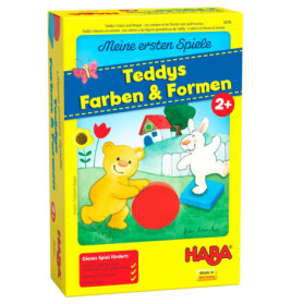 Gelbe Spielschachtel mit Bär und Hase, die auf einer Wiese mit Formen spielen Aufschrift: Teddys Farben & Formen.