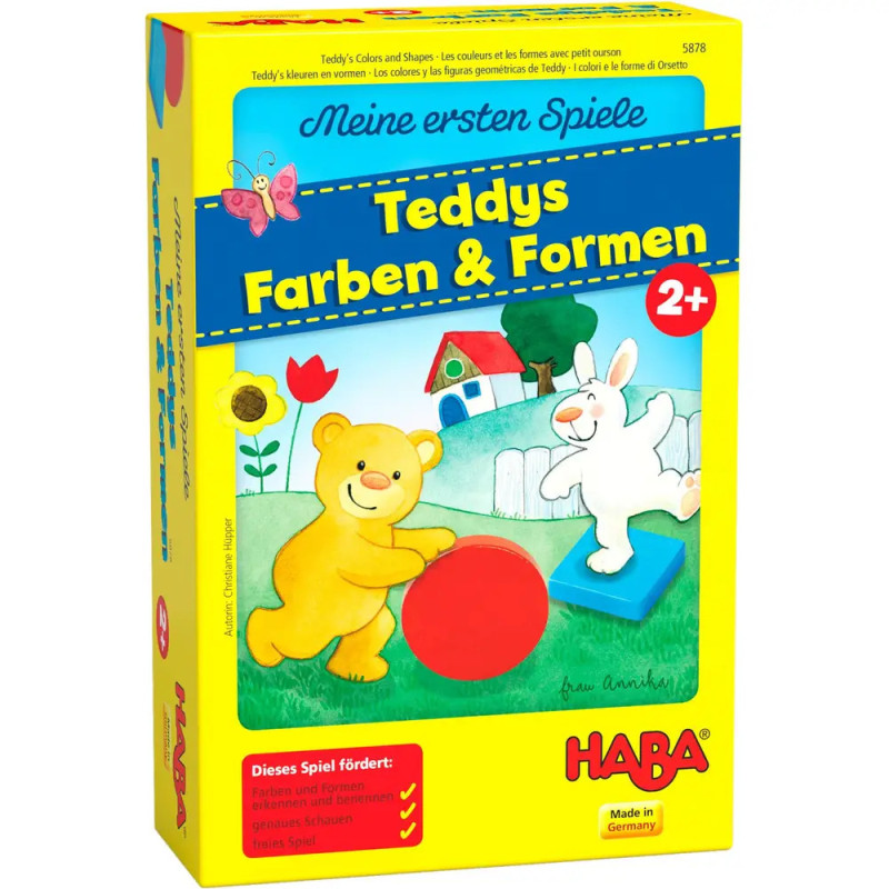 Gelbe Spielschachtel mit Bär und Hase, die auf einer Wiese mit Formen spielen Aufschrift: Teddys Farben & Formen.
