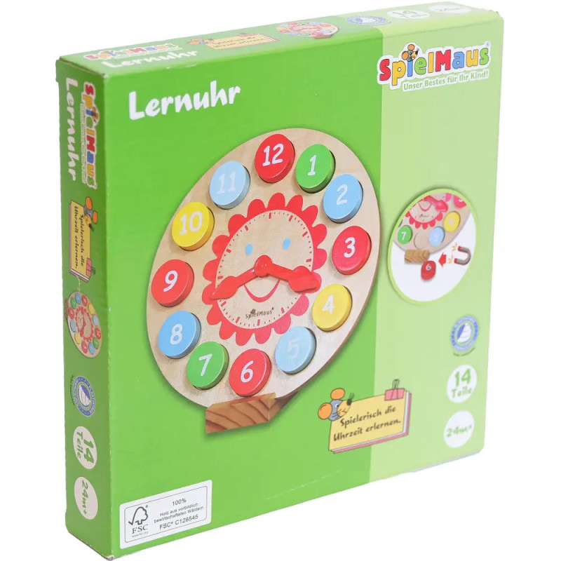 Grüne Verpackung der SpielMaus Lernuhr aus Holz mit bunten Zahlen und Zeigern. Grüne Verpackung der SpielMaus Lernuhr aus Holz mit bunten Zahlen und Zeigern.
