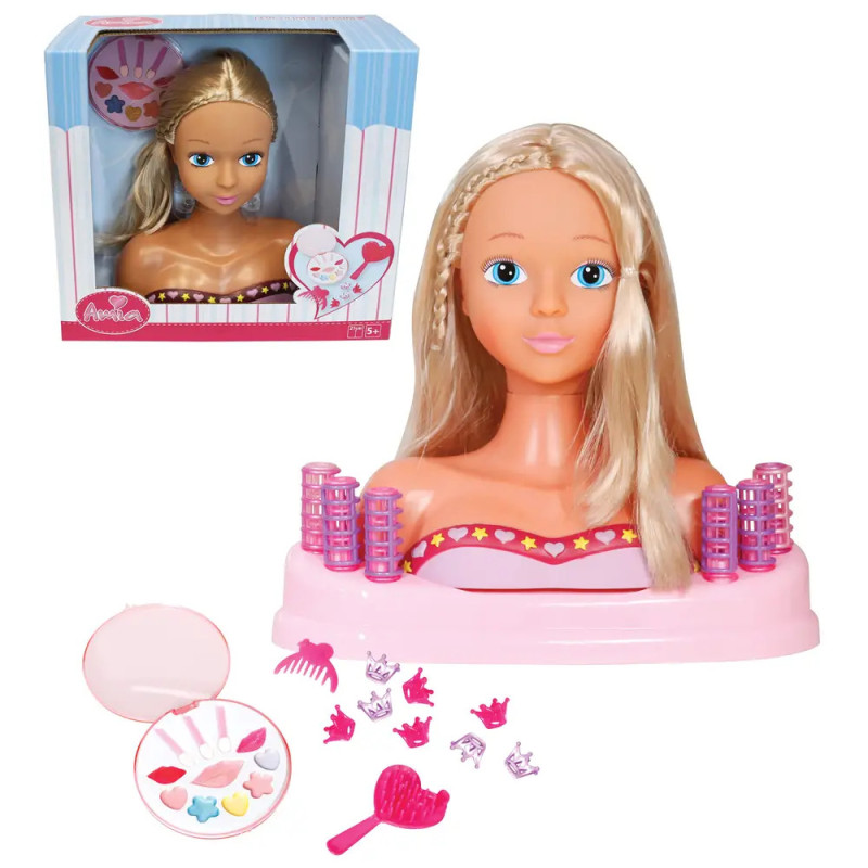 Styling-Puppenkopf mit blonden Haaren, Zubehör wie Kamm und Schminke Verpackung im Hintergrund sichtbar.