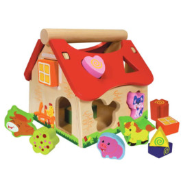 Ein Holz-Steckhaus mit verstreuten Tier- und Formbausteinen.