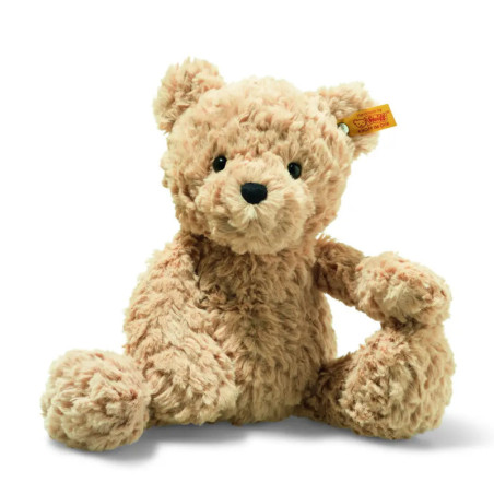 Hellbrauner, flauschiger Teddybär mit schwarzen Augen und Nase sitzt aufrecht vor weißem Hintergrund. Hellbrauner, flauschiger Teddybär mit schwarzen Augen und Nase sitzt aufrecht vor weißem Hintergrund.