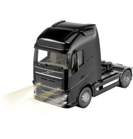 Schwarzer Spielzeug-Lkw mit eingeschaltetem Licht, auf weißem Hintergrund, leicht nach links gerichtet.