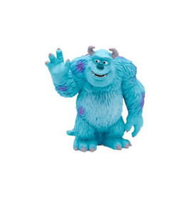 Blaues, pelziges Monster mit lila Flecken und Hörnern winkt lächelnd vor weißem Hintergrund.