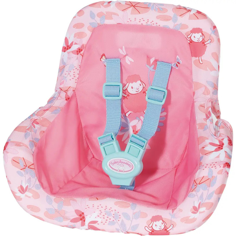 Pinker Puppensitz mit Blumenmuster, blauem Gurt und Stoff mit Cartoonmädchen.