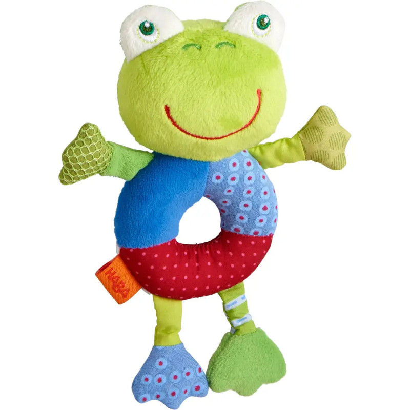 Plüschfrosch mit rundem Körper, großen Augen, rotem Lächeln und bunt gemusterten Armen und Beinen. Plüschfrosch mit rundem Körper, großen Augen, rotem Lächeln und bunt gemusterten Armen und Beinen.