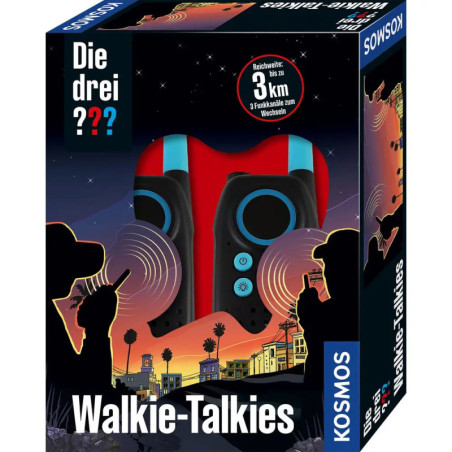 Box der Die drei ?? Walkie-Talkies mit Stadtsilhouette und Sonnenuntergang, zwei Geräte hinter einem Fenster sichtbar.