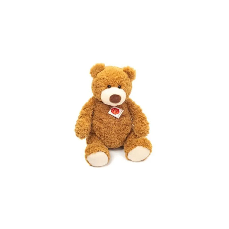 Ein brauner Plüsch-Teddybär mit rot-weißem Etikett sitzt vor weißem Hintergrund. Ein brauner Plüsch-Teddybär mit rot-weißem Etikett sitzt vor weißem Hintergrund.