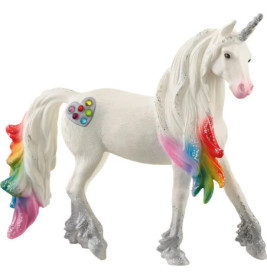 Weiße Einhornfigur mit regenbogenfarbener Mähne, Schwanz und glitzerndem, herzförmigem Fleck an der Seite.