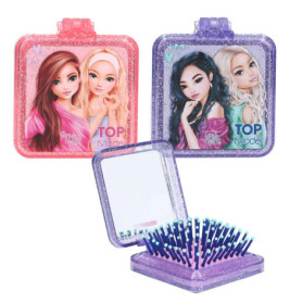 Zwei glitzernde, quadratische Dosen mit Mädchenmotiv, eine offen mit Spiegel und Haarbürste.