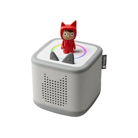 Graue Toniebox mit roter Figur oben auf und katzenförmigen Lautsprecheröffnungen an der Seite.