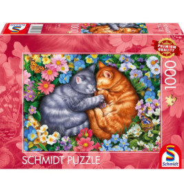 Puzzlebox mit zwei kuschelnden Katzen, grau und orange, umgeben von bunten Blumen.