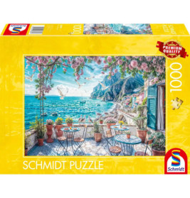 Schmidt Puzzle, 1000 Teile, mit Motiv einer Terrasse am Meer mit Tischen und Blumen.