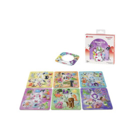 Sieben bunte Puzzlekarten und eine runde Karte liegen neben der Tonies Monster Party Spielbox.