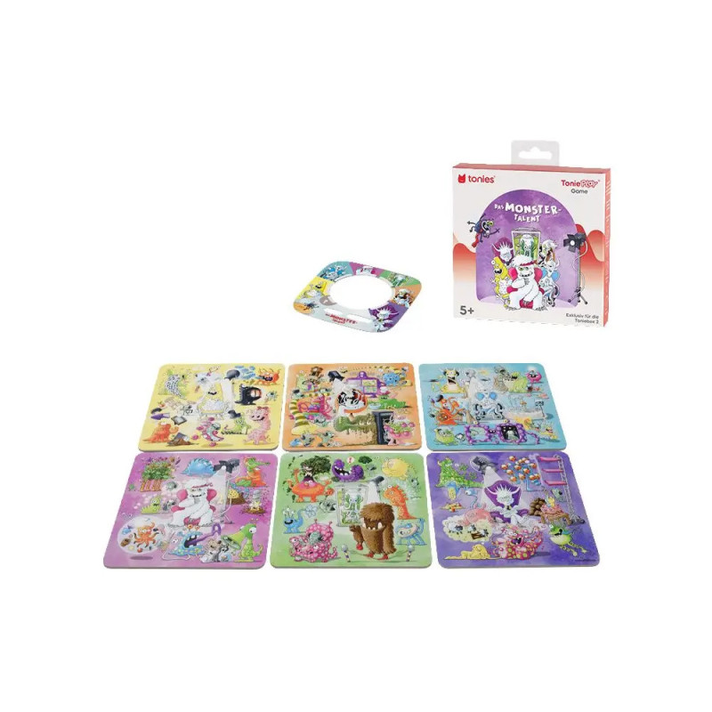 Sieben bunte Puzzlekarten und eine runde Karte liegen neben der Tonies Monster Party Spielbox.