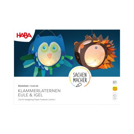 Zwei leuchtende Papierlaternen in Eulen- und Igel-Form aus einem HABA Bastelset.