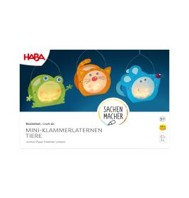 Drei Tier-Laternen (Frosch, Katze, Maus) stehen auf einer weißen Bastelbox von HABA.
