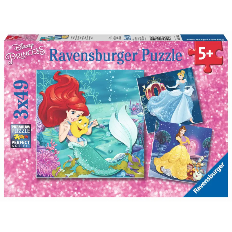 Ravensburger Puzzlebox mit Disney-Prinzessinnen Ariel, Cinderella und Belle vor pinkem, funkelndem Hintergrund.