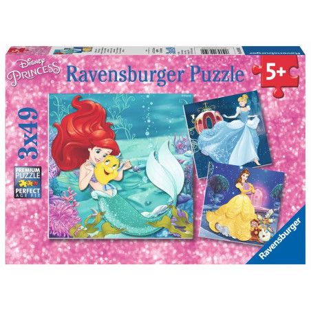 Ravensburger Puzzlebox mit Disney-Prinzessinnen Ariel, Cinderella und Belle vor pinkem, funkelndem Hintergrund.