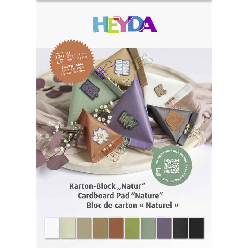 Heyda Kartonblock mit Papierbastelarbeiten, Clips und unten angeordneten Pastellfarbmusterkarten.