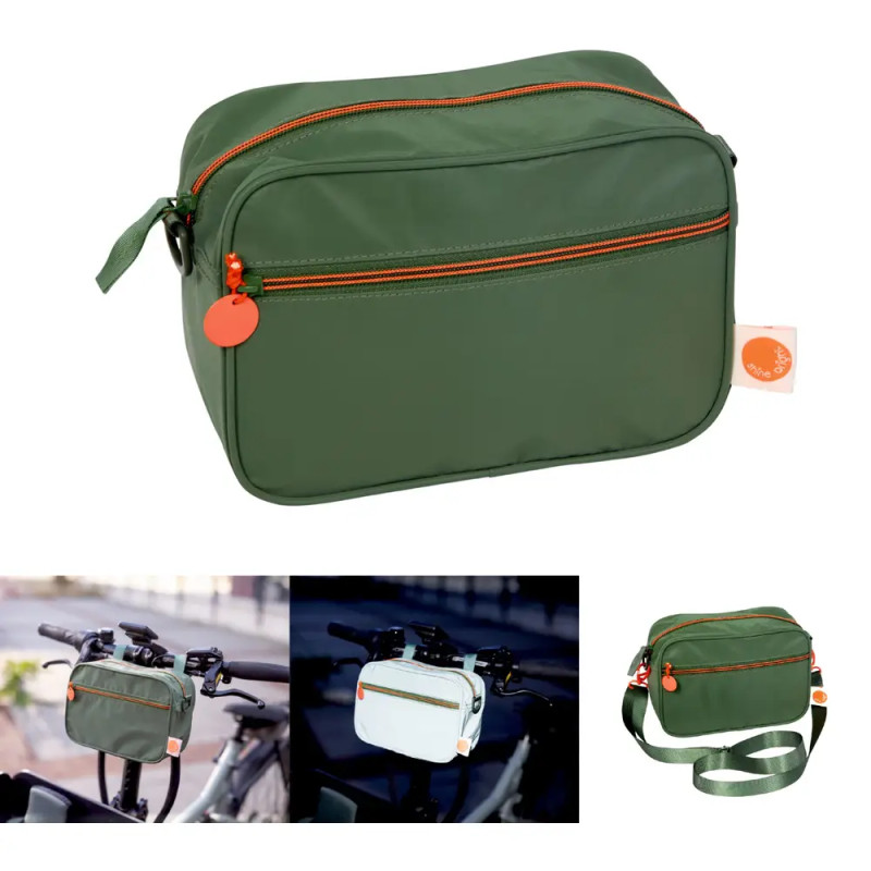 Grüne, rechteckige Tasche mit orangefarbenem Reißverschluss, einzeln und am Fahrrad bei verschiedenen Lichtverhältnissen.