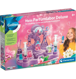 Parfümlabor-Set mit bunten Fläschchen und lachendem Mädchen, geeignet für Kinder ab 8 Jahren.
