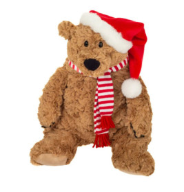 Ein brauner Plüsch-Teddybär trägt eine rote Weihnachtsmütze und einen rot-weiß gestreiften Schal.