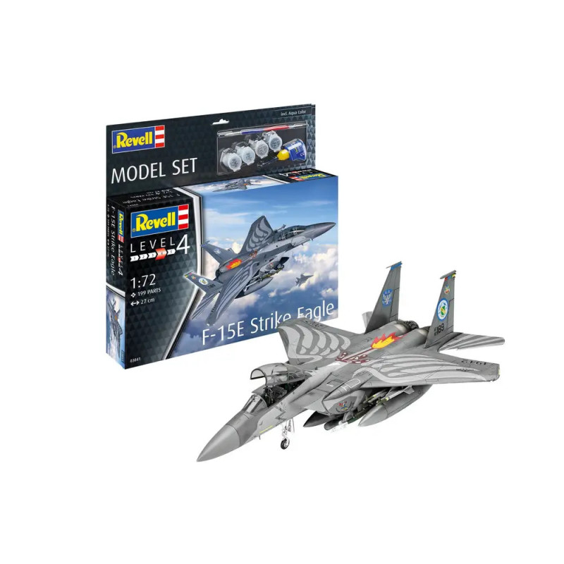 Revell F-15E Strike Eagle Modellbausatz 1:72 mit Box, Farben, Pinseln und gebautem Flugzeugmodell.