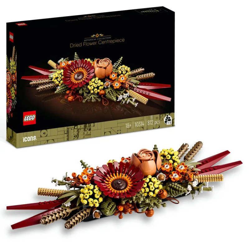 LEGO Set mit getrockneten Blumen als Tafelaufsatz: Zusammengebautes, detailreiches Blumengesteck neben der Verpackung. LEGO Set mit getrockneten Blumen als Tafelaufsatz: Zusammengebautes, detailreiches Blumengesteck neben der Verpackung.