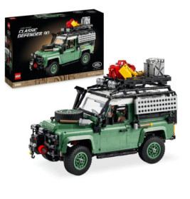 LEGO Classic Defender 90 Modellauto mit Dachgepäckträger, Ausrüstung und Verpackung im Hintergrund.