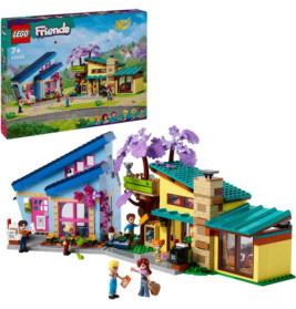 LEGO Friends Set mit bunten Gebäuden, Minifiguren und Verpackung mit Modellabbildung im Hintergrund.