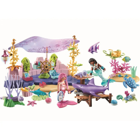 Zwei Meerjungfrau-Puppen spielen in einem bunten Unterwasser-Spielset mit Meerestieren und Ozean-Zubehör.