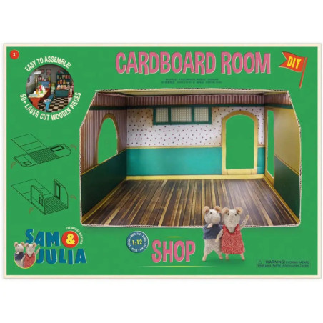 Karton-Spielset mit Mäusefiguren und Bastelanleitung, präsentiert auf grünem Hintergrund.