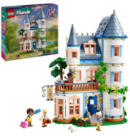 LEGO Friends Set mit zweistöckigem Haus, drei Minifiguren, Hund und Produktverpackung im Hintergrund.