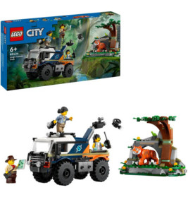 LEGO City Set mit Truck, Tiger, Minifiguren und Dschungelhöhle, Verpackung im Hintergrund.