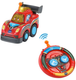 Rotes Spielzeugauto mit blauen Rädern und lachendem Gesicht neben rundem roten Controller mit blauen Tasten.