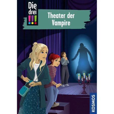 Drei Mädchen auf einer Bühne blicken ängstlich auf die Silhouette eines Vampirs, der auf einen Vorhang projiziert ist.