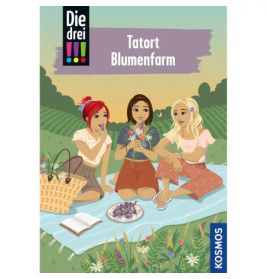 Drei Mädchen sitzen auf einer Picknickdecke im Blumenfeld, unterhalten sich und halten Blumen, ein Korb liegt daneben.