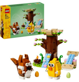 LEGO-Set mit Baum, braunem Hasen, gelbem Küken und bunten Eiern, Verpackung im Hintergrund.