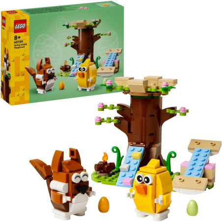 LEGO-Set mit Baum, braunem Hasen, gelbem Küken und bunten Eiern, Verpackung im Hintergrund. LEGO-Set mit Baum, braunem Hasen, gelbem Küken und bunten Eiern, Verpackung im Hintergrund.