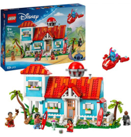 LEGO Disney Set mit buntem Haus, Figuren, Surfbrettern und Raumschiff, Verpackung im Hintergrund sichtbar.
