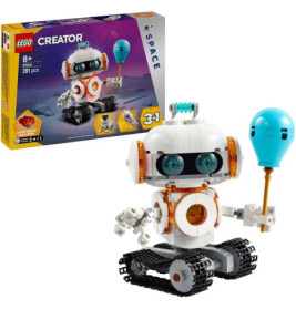 LEGO Creator Roboter mit blauem Ballon, im Hintergrund die Verpackung mit Weltraummotiv.