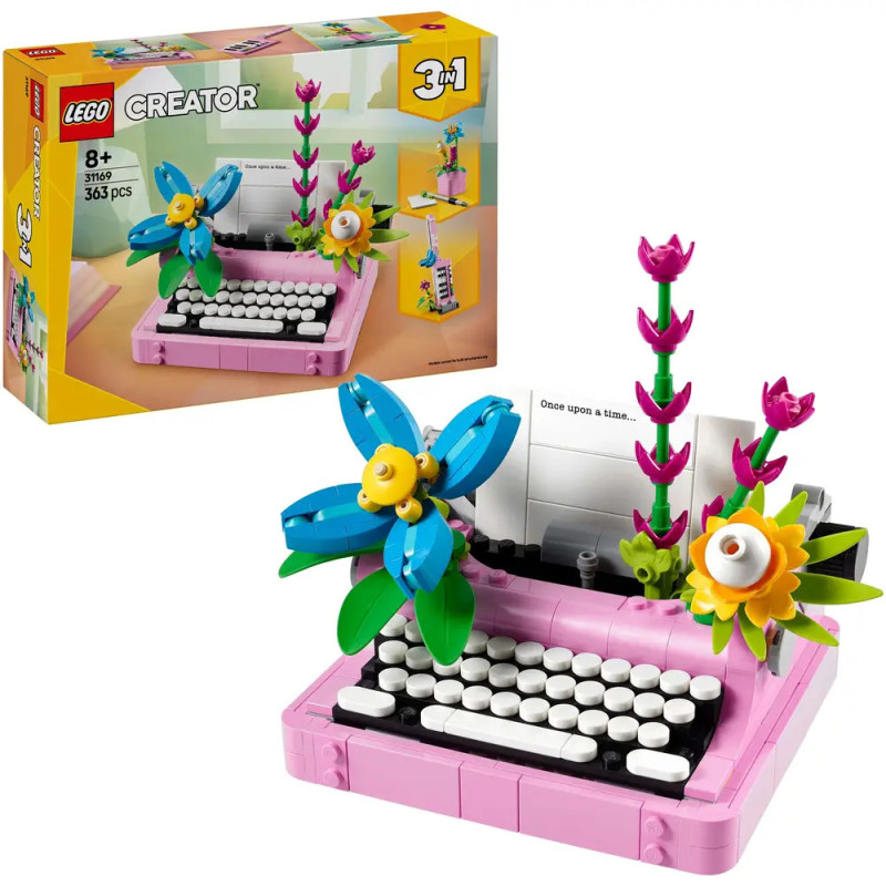LEGO Creator 3-in-1 rosa Schreibmaschine mit bunten Blumen, aufgebaut und auf der Verpackung abgebildet.