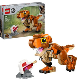 LEGO Jurassic World T-Rex mit baubarem Fleisch-Accessoire, Verpackung im Hintergrund.