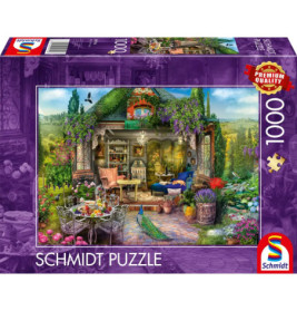 1000-Teile Schmidt Puzzle mit Gartenhaus, bunten Blumen und Gartenmöbeln auf dem Cover.