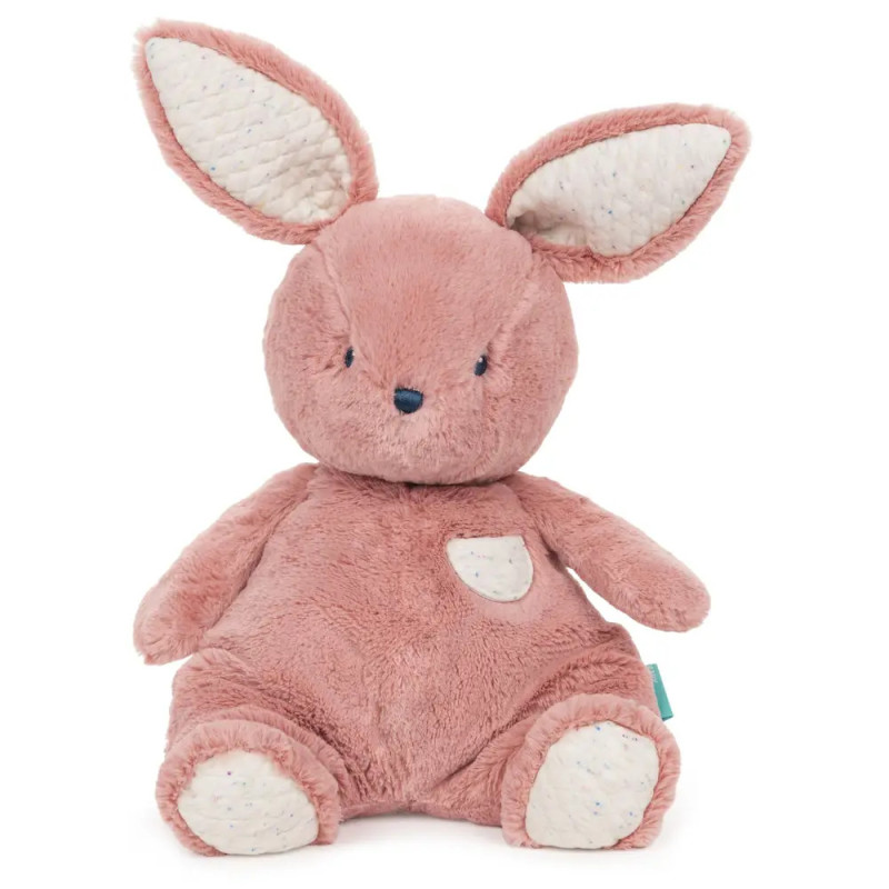Rosa Plüschhase mit großen Ohren, weißen Akzenten und einer kleinen Bauchtasche. Rosa Plüschhase mit großen Ohren, weißen Akzenten und einer kleinen Bauchtasche.