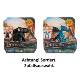 Zwei Drachenzähmen-leicht-gemacht-Figuren in Boxen: Ohnezahn (schwarz) und Deadly Nadder (blau).