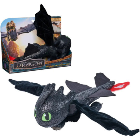 Plüsch-Drache aus Drachenzähmen leicht gemacht mit grünen Augen, schwarzen Flügeln und Verpackung.
