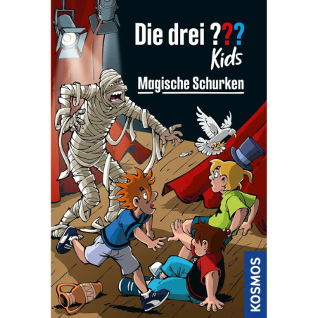 Drei Kinder erschrecken auf einer Bühne vor einer Mumie im Hintergrund Taube, rote Vorhänge und deutscher Text oben.